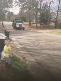 Little boy gives cookies to favorite garbage men ❤️