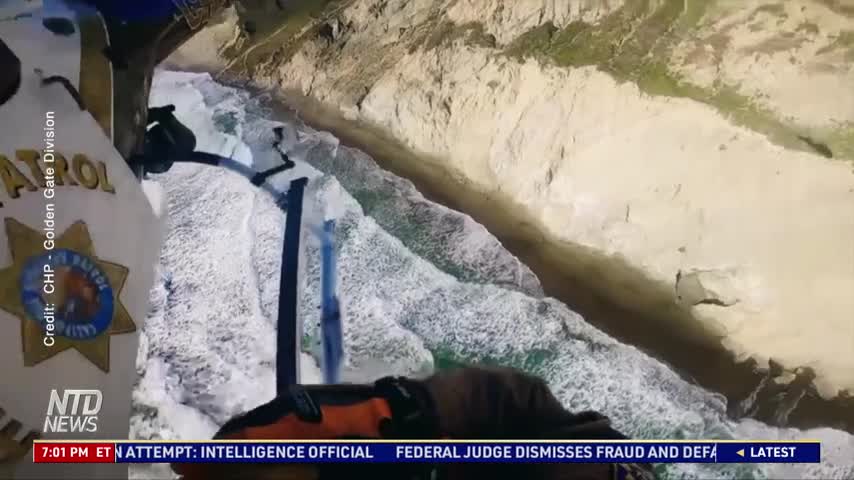 Helicopter Rescues Man Stuck on Cliff Wall