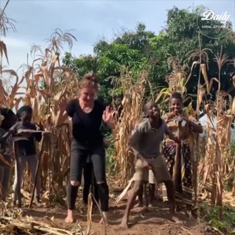 Girl Dances With African Kids