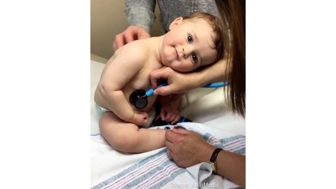 Baby Boy Lays Head on Nurse