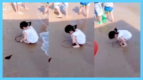 Little Girl Refuses to Give up as the Sea Keeps on Washing Away Her Heart Drawing | Humanity Life
