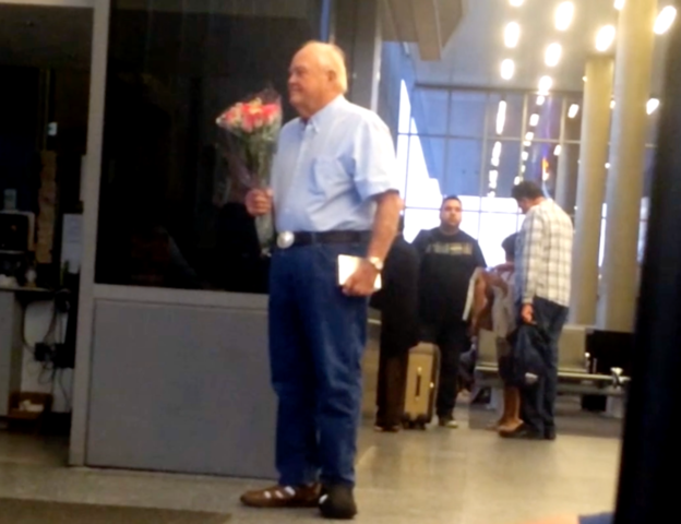 Man Waits for Wife with Flowers and Chocolates