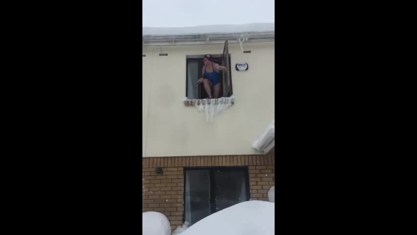 Man in Swimsuit Jumps From Second-Story Window into Snow