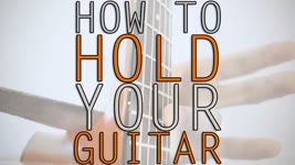 How To Hold A Guitar