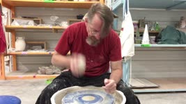 Man Does Pottery with Cat