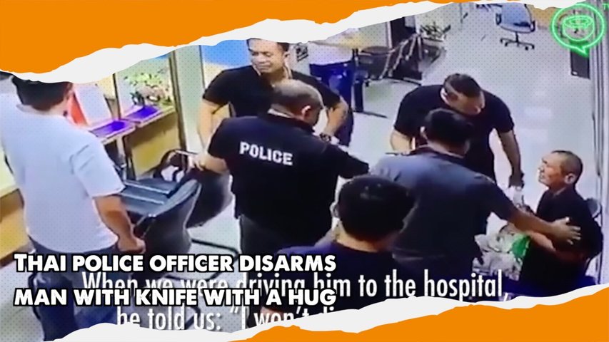 Thai police officer disarms man with knife with a hug