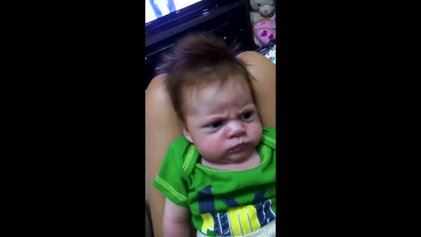 Baby Scowls at Parents Trying to Make Him Smile