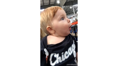 Toddler Is Amazed by Christmas Decorations