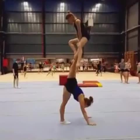 Pair of Girls Perform Acrobatic Trick