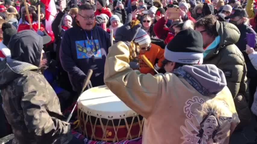 Protesters perform with a traditional First Nations drum during COVID-19 protest in Ottawa on January 29, 2022