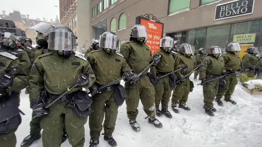 Police confront protesters in Ottawa on Feb. 19, 2022