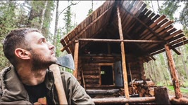 Build log cabin in taiga. Working on the roof. Forest Film