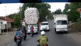 Over loaded Truck Topples Over 