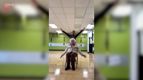 Senior Citizen Performs Dance Routine in Chair.mov