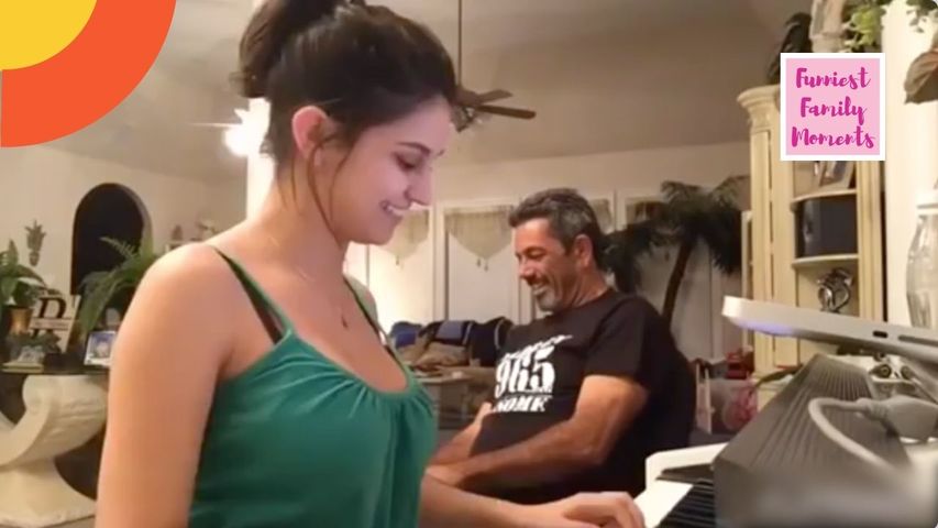 Girl Laughs While Attempting to Sing Cover Song With Dad
