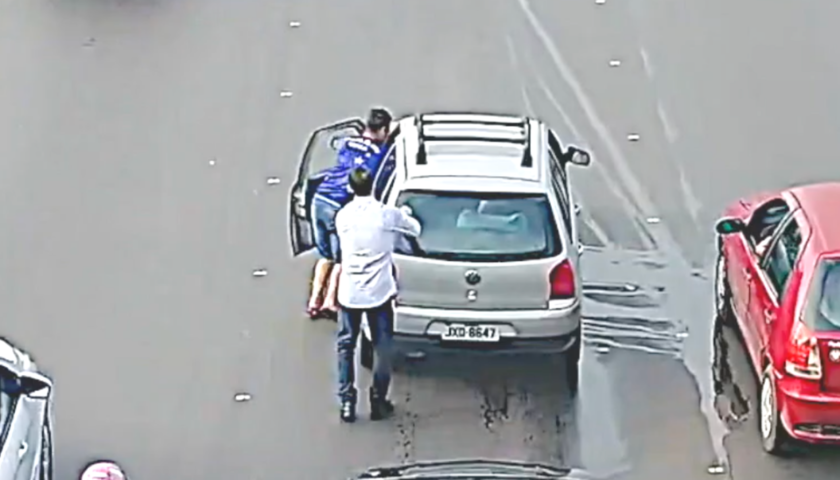 Guy Jumps Through the Window Of Moving Car And Saves It From Crashing