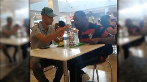 Fast food worker feeds disabled man