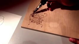 Pyrography, using a Dremel 2000 Versatip. Outlined of letter roughed in. Wood burn letters