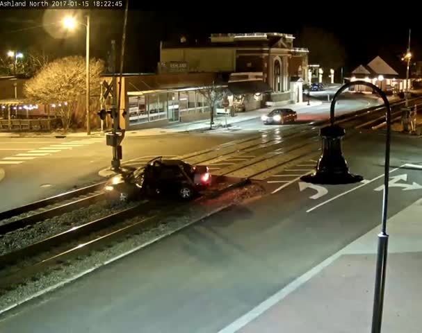 Train Pushes Car off of Track