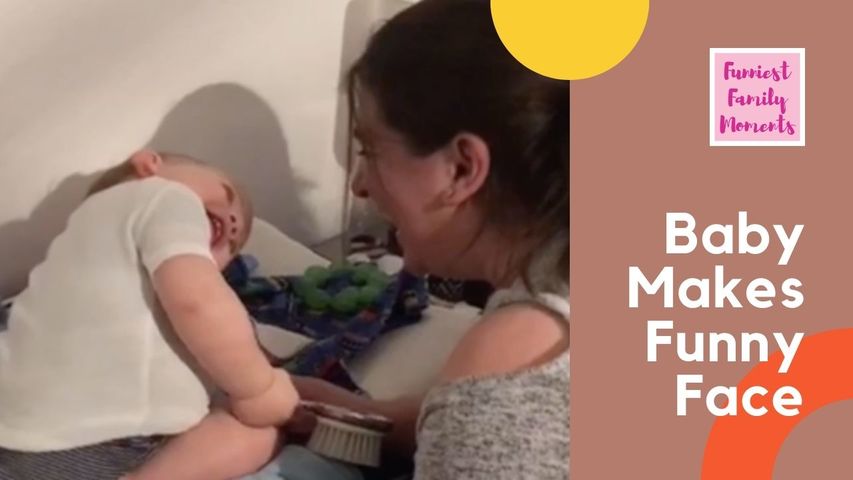 Baby Makes Funny Face While Brushing Mom's Hair
