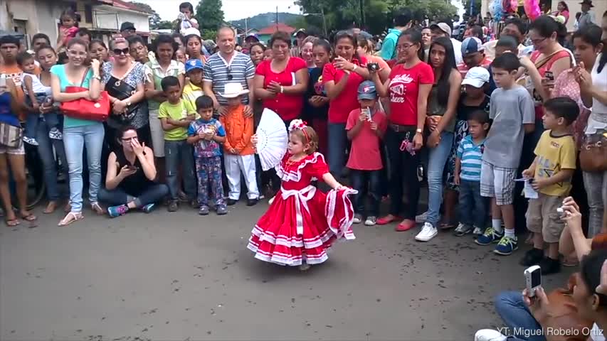 A 3-year-old Girl Dances Traditional Marimba