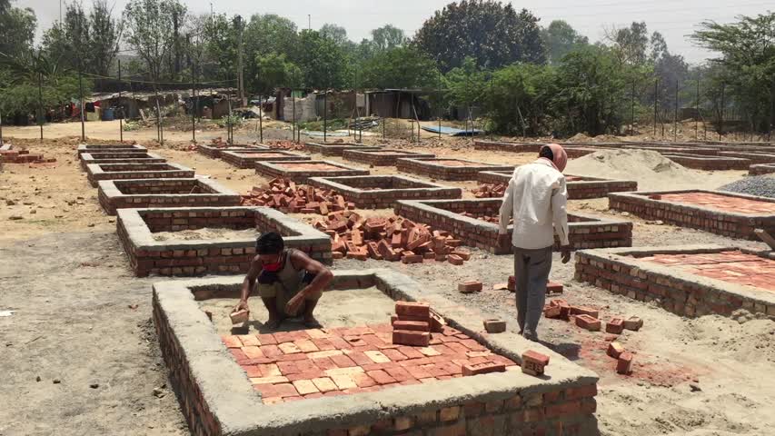 Funeral pyres under construction at a crematorium outside New Delhi, India on May 4, 2021