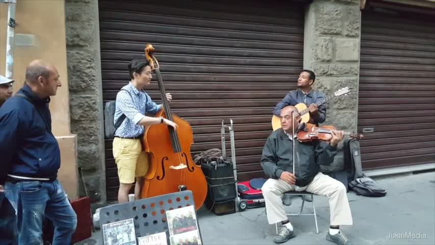 Bassist Player Joins Street Performers		